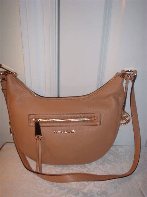 michael michael kors rhea small zip messenger bag suntan|Michael Kors Signature Rhea Zip Extra Small Messenger .